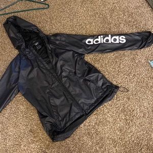 Adidas black rain jacket. In new like condition.